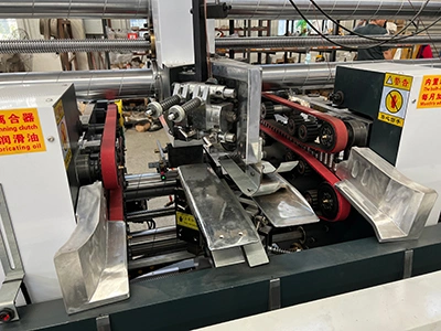 Sección de salida del cabezal de grapado / cosido